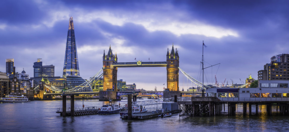 London Tower Bridge and The Shard illuminated over Thames panorama