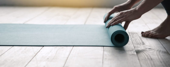 Photo of a yoga mat and a person